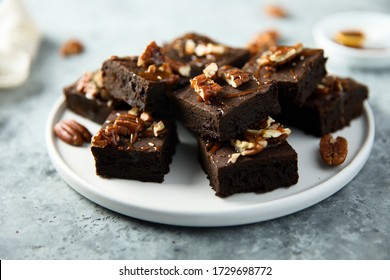 Traditional homemade brownies with salted caramel and pecan nuts - Powered by Shutterstock