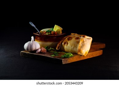 Traditional Homemade Empanadas And A Bowl Of Pebre On A Table, Traditional Food Of National Holidays In Chile 