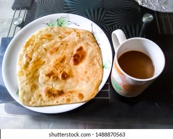 traditional Homemade Pakistani breakfast Chai and Paratha in morning. - Shutterstock ID 1488870563