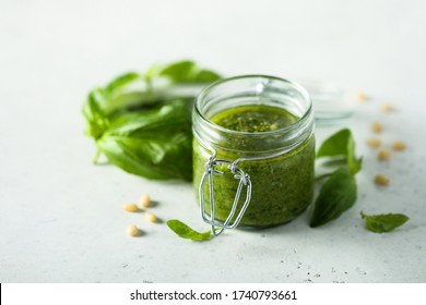 Traditional homemade pesto sauce in a jar - Powered by Shutterstock