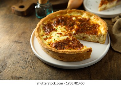 Traditional homemade quiche or pie with ham and cheese