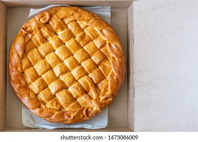 Traditional Homemade Rustic Baked Pie With Seasonal Fruit Or Meat Filling In Cardboard Box. Fast Food To Go. Bakery Delivery Menu. Flat Lay. Copyspace