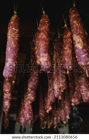 Traditional homemade saucissons hanging to dry