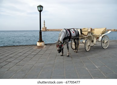 Traditional Horse And Cart On Quay Of City Of Island Crete, Greece .