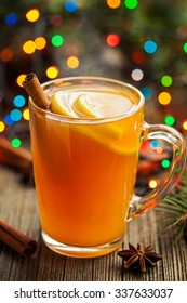 Traditional Hot Apple Cider Alcohol Drink Winter Season Refreshment Juice. Healthy Organic Christmas Or Thanksgiving Beverage With Spices. Hot Steam And Colorful Boke. Vintage Wooden Background.