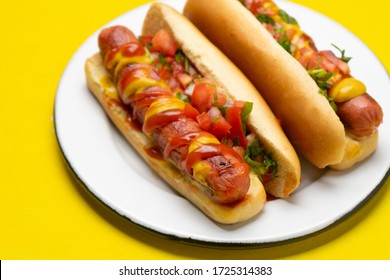 Traditional Hot Dog With Pico De Gallo Salad On Yellow Background