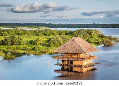 Traditional House On The Amazon River In Iquitos, Loreto, Peru