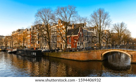 Similar – Foto Bild Architektur niederländischer Häuser und Hausboote am Amsterdamer Kanal