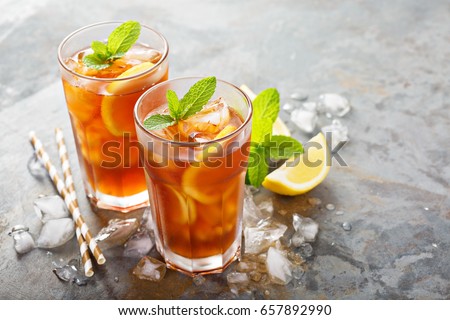 Traditional iced tea with lemon and ice in tall glasses