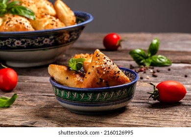 Traditional Indian cuisine samosas baked pastry with savoury filling, popular Indian snacks with spices on rustic background, top view. - Shutterstock ID 2160126995