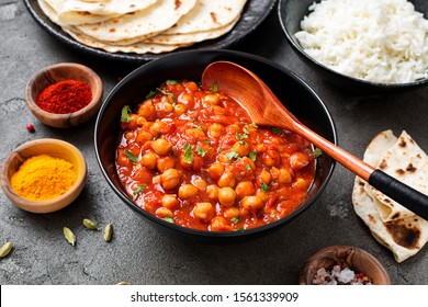 Traditional Indian Dish Chickpea Chana Masala With Rice And Flatbread.