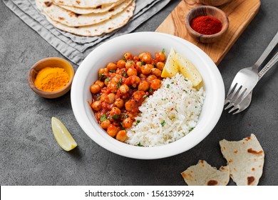 Traditional Indian Dish Chickpea Chana Masala With Rice And Flatbread.