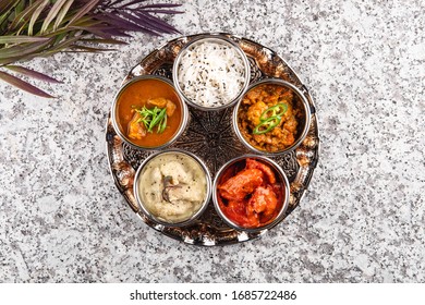 Traditional Indian Dish Tali On A Grey Stone Table, Horizontally Top View