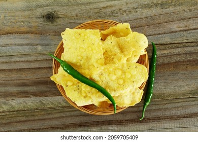 traditional indian gujarati snack food fafda with chilli in bamboo basket top view
