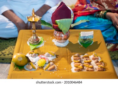 Traditional Indian Wedding Ceremony. Items For Pooja Kalash,
Diya, Betel Nuts, Coconut, Mango Leaves Etc. Selective Focus