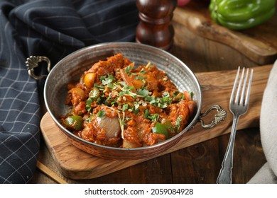 Traditional IndianBritish dish chicken tikka masala background. Spicy chicken tikka masalacurry in bowl, indian bread naan, fresh cilantro. Indian style dinner. Space for text. Top view. Indian food