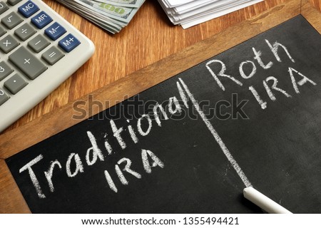 Traditional IRA vs Roth IRA written on blackboard.