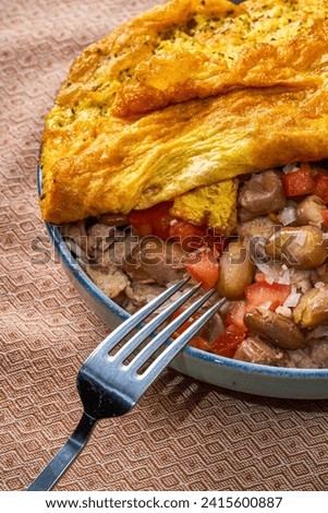 Traditional Iraqi breakfast: fried eggs and beans (baqila with fat and eggs) باقلا بالدهن [[stock_photo]] © 
