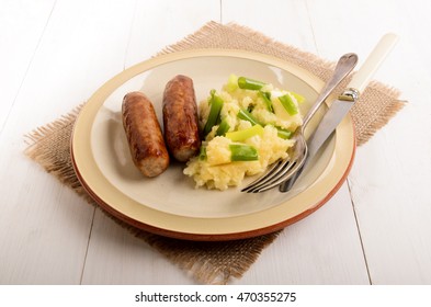 Traditional Irish Champ With Home Made Sausages On A Plate