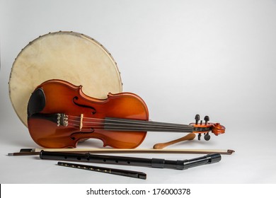 Traditional Irish musical instruments on a white background