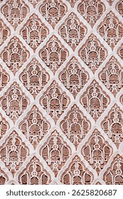 Traditional islamic geometric pattern decorating a wall in Morocco, creating a mesmerizing and ornate design