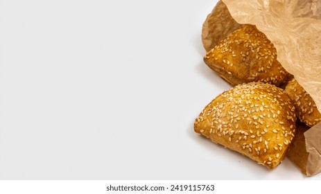 Traditional Israeli pastry Bourekas with cheese on white background with copy space.