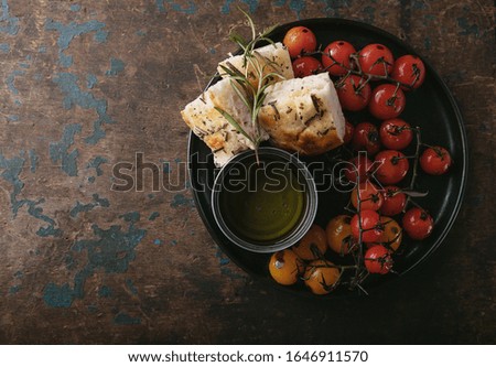 Similar – Focaccia bread with knife and olive oil