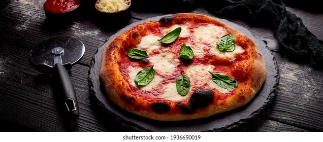 Traditional italian artisanal pizza. tasty and delicious made with tomatoes, cheese and basilico, high quality photo with copyspace