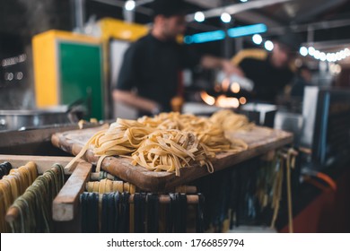 Traditional Italian Black And Yellow Raw Pasta On Food Festival