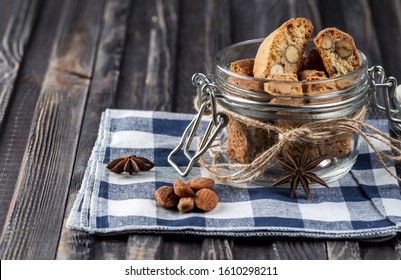 Traditional italian Christmas New Year dry cookies biscuits biscotti cantuccini. Biscotti di Prato. In glass jar.