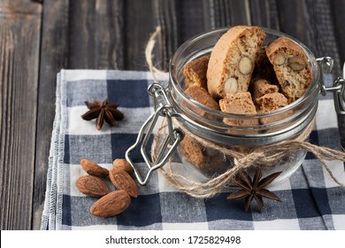 Traditional italian Christmas New Year dry cookies biscuits biscotti cantuccini. Biscotti di Prato. In glass jar.