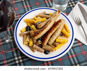 Traditional Italian Creamy Rigatoni Pasta With Olives And Fried Spicy Chicken Sausages..