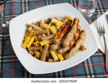 Traditional Italian Creamy Rigatoni Pasta With Olives And Fried Spicy Chicken Sausages..