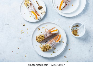 Traditional italian dessert cannoli siciliani on the light background, top view image with a copy space for your text