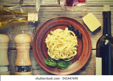 Traditional Italian Dinner. Pasta, Fettuccine, Wine.