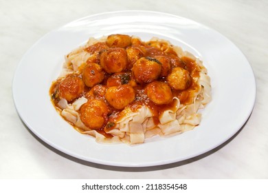Traditional italian pasta with meatballs, polpette and fettuccine in red tomato sauce. - Shutterstock ID 2118354548
