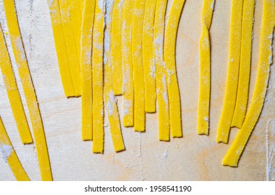Traditional Italian Pasta Noodles Being Prepared From Wholegrain Wheat Flour In Restaurant Kitchen,shot In Flat Lay Directly From Above On Wooden Table.Download Royalty Free Curated Images Collection