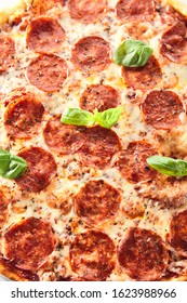 Traditional Italian Pepperoni Pizza With Salami, Chili Pepper, Mozzarella Cheese, Fresh Basil, Tomatoes And Tomato Sauce Isolated. Delicious Italy Salami Flatbread Cutout, Tasty Fast Food Closeup