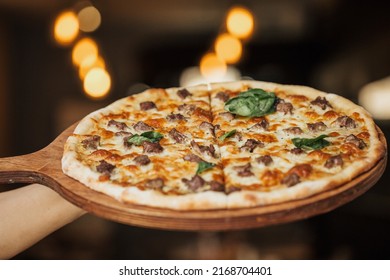 Traditional Italian Pizza with mozzarella, tomatoes and salami over black background, copy space. Delivery pizza or pizzeria promotional concept, Pizza Margherita, top view Pizza Margarita with Tomato - Shutterstock ID 2168704401