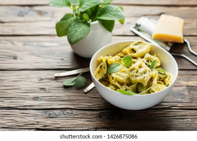Traditional italian raviolli with sage and ricotta, rstic style and selective focus