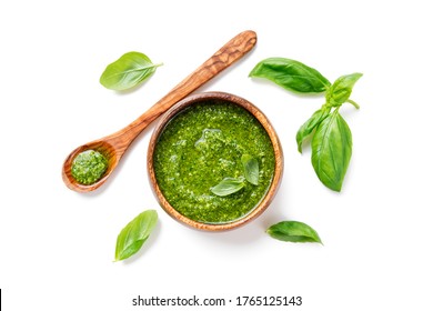 Traditional italian sauce pesto with green basil in wooden bowl isolated on white background - Powered by Shutterstock