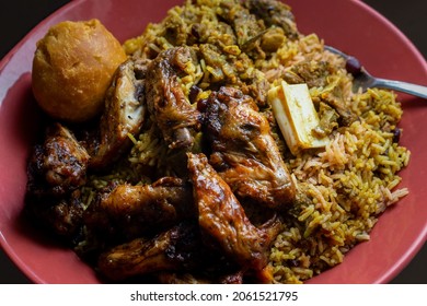 Traditional Jamaican Jerk Chicken Wings, Curried Goat And Fried Dumpling With Rice And Peas