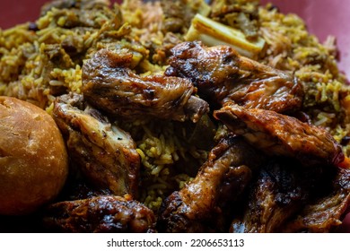 Traditional Jamaican Jerk Chicken Wings, Curried Goat And Fried Dumpling With Rice And Peas