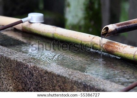 Traditional Japanese Bamboo Fountain Dripping Water With Ripples In A Basin Traditional Japanese Bamboo Fountain Dripping Water With Ripples In A Basin