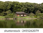 Traditional Japanese chashitsu tea room called Tsubame-no-ochaya or Swallow teahouse along the Shiori-no-ike pond of the Hamariku Gardens