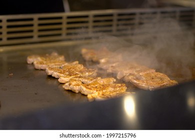 Traditional Japanese Cooking In A Flat Pan Prepared By The Chef In Front Of The Customer. (Teppanyaki)