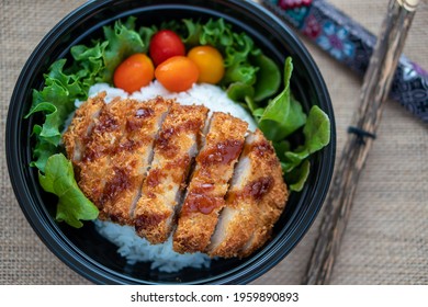 the traditional Japanese food Tonkatsu with vegetable in the bowl 