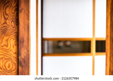Traditional Japanese house machiya or ryokan in Japan with abstract closeup of shoji sliding paper door open white background in room