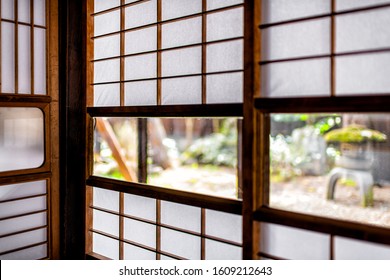 Traditional japanese house onsen ryokan hotel in Japan with shoji sliding paper doors and window to green garden