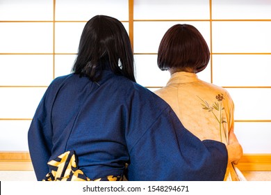 Traditional Japanese House Sliding Door Window With Romantic Woman And Man Couple In Kimono Costume Standing